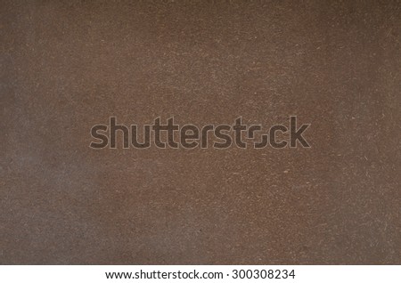 clay wall with a straw in the composition