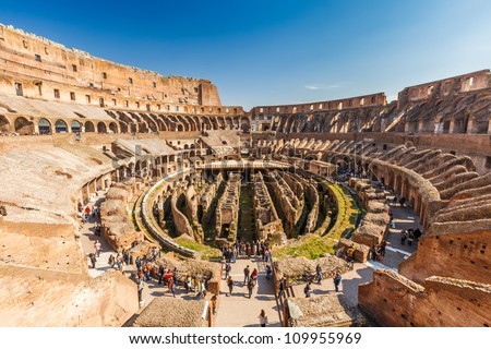ROME - MARCH 8, 2012: Tourists visit Coliseum on March 8, 2012 in Rome. Coliseum is the largest amphitheater ever built in the Roman Empire