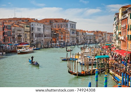 VENICE - APRIL 1, 2010: Tourists visit the Grand canal on April 1, 2010 in Venice, Italy . More than 20 million tourists come to Venice annually.