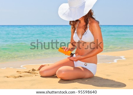 Young woman enjoy sun on the beach