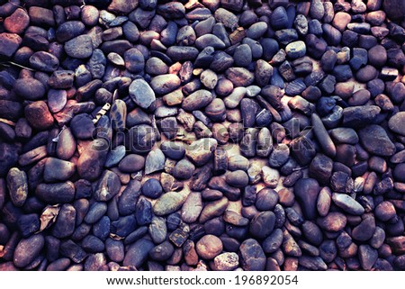 sea stones background on the floor and dramatic lighting