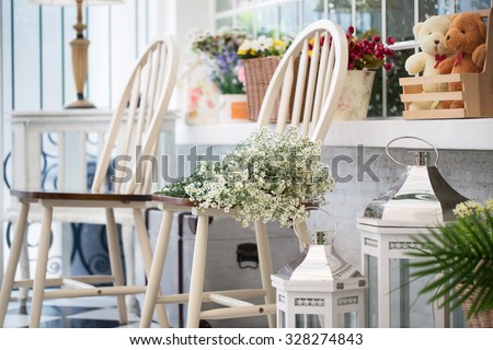 Interior design of room with furniture and flower in beige-white