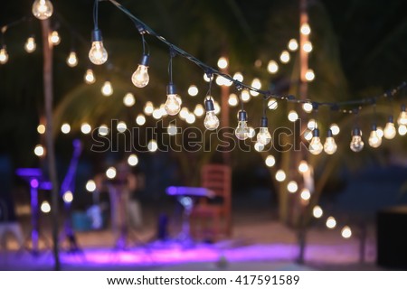 Hanging decorative lights for a wedding party