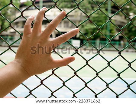 left hand with fence