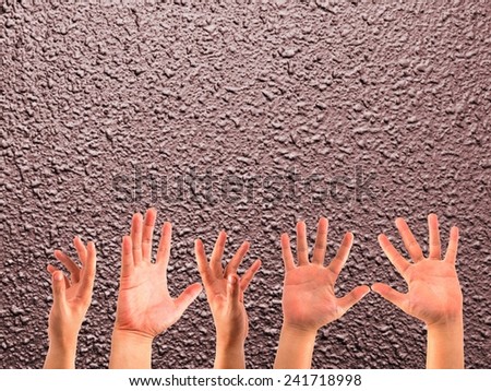 many hands on the blurred bright colors wall backgrounds