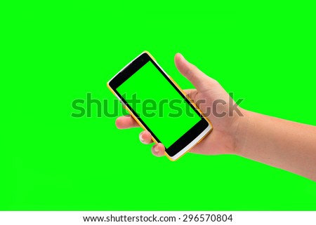 hand holding cell phone on green screen background