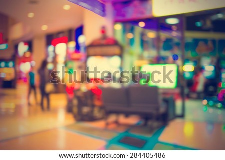 Arcade game machine shop blur background with bokeh image - vintage effect style pictures.