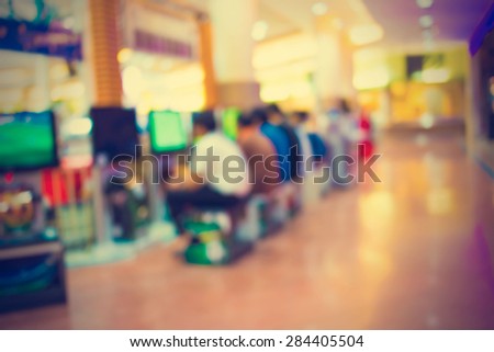 Arcade game machine shop blur background with bokeh image - vintage effect style pictures.