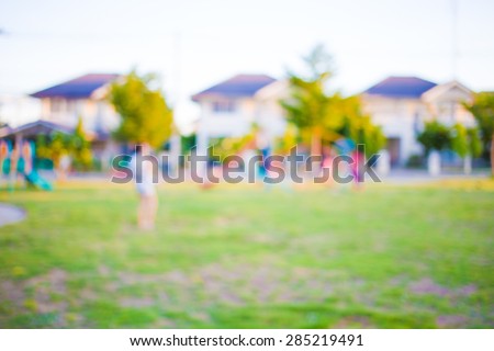Blur image of children's playground at public park for background usage.
