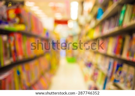 Blur image of book store on shelf at shopping center for background usage.