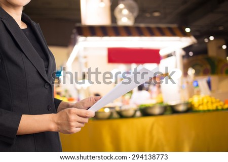 Businesswoman reading a business document.