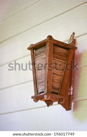 wood lamp hanging on wooden wall