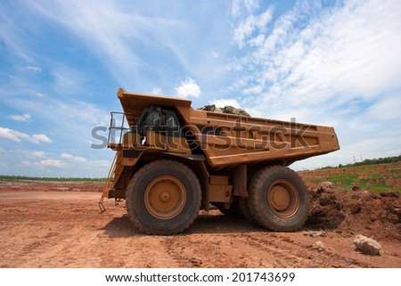 big yellow mining truck at work site