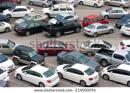 BANGKOK - AUG 23: Car parked at a park and side lot at a BTS station in Chatuchak district on AUG 23, 2014 in Bangkok, Thailand. The government has promoted park and ride to reduce traffic congestion.