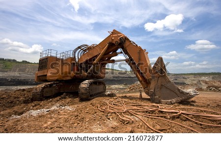 LAMPANG, THAILAND - JUNE 26: coal-preparation plant. track-type loader excavator machine at work site coal transportation, June, 26, 2014 in Lampang, Thailand