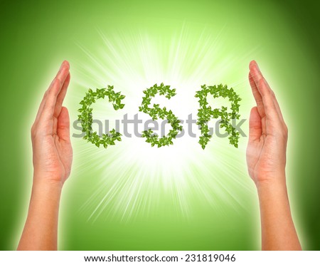 leaf arranged in csr shape with supporting hands - corporate social responsibility conceptual image.