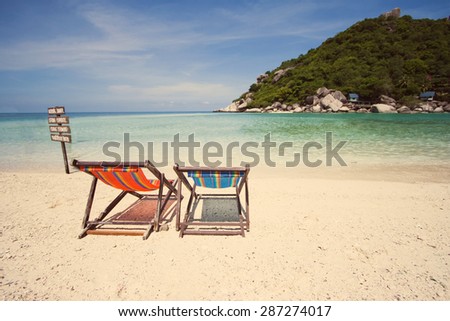 Two Deck chair on the beach at Nang yuan island , Thailand - vintage effect style