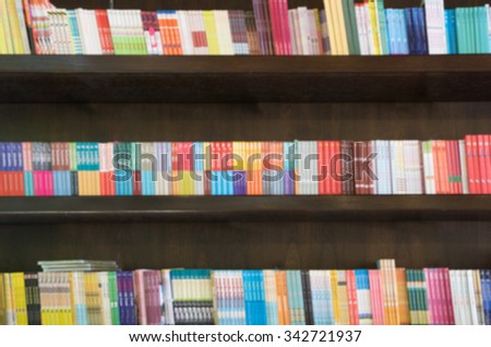 Blured books in public library. Blured effect. Background for you design