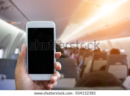 Man use your phone in airplane blurred background - mockup template - sunlight filter effect