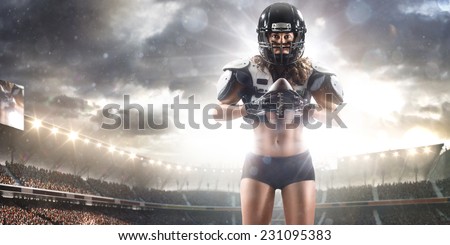 American football woman player holding ball on the stadium Panorama view