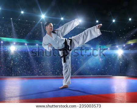 professional female karate fighters are fighting on the grand arena