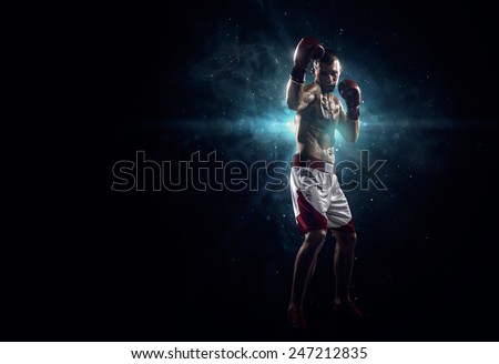 Professionl boxer is standing in the spotlight