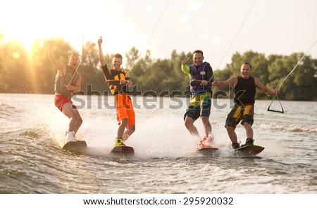 Four wake bord riders are having the fun