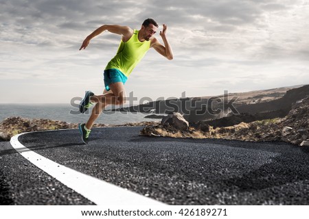 Male runner sprinting during outdoors training for marathon run