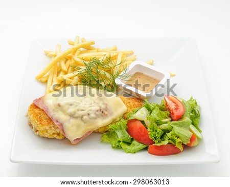 Chicken cutlet with ham and cheese isolated on white