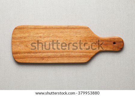 Wooden Chopping Board on the linen