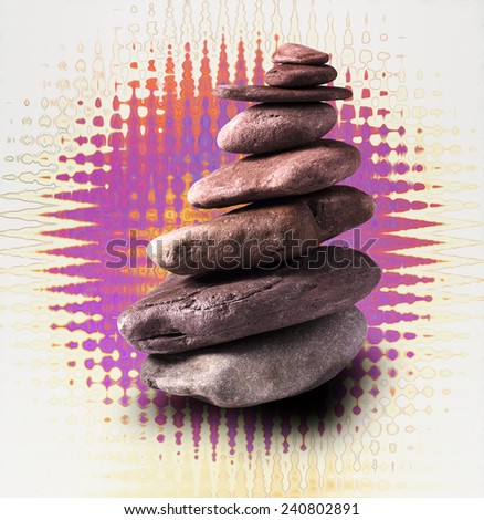 Zen like balanced stone tower with abstract backgorund.