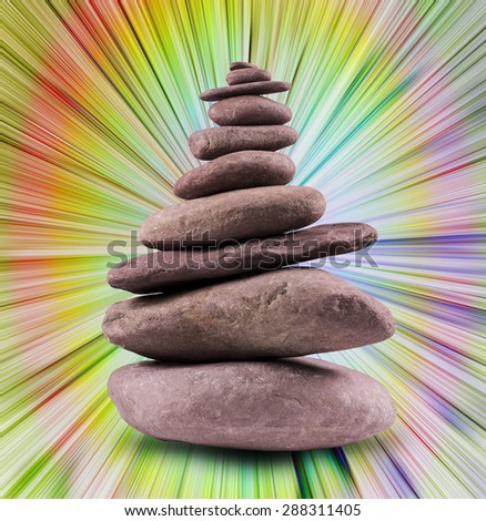Zen like, balanced stone tower with a background.