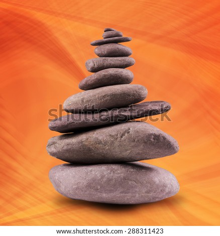 Zen like, balanced stone tower with a background.