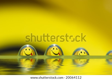Funny droplets team with smiley reflection