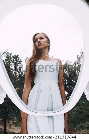 Beautiful face beauty woman in mirror reflection, outdoor