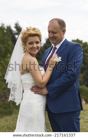 Portrait of smiling happy couple, outdoor. New family