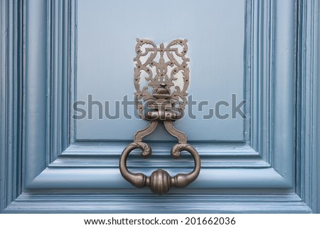 Vintage Door knocker on a blue door