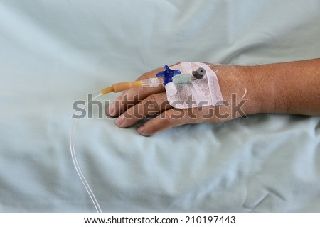 Intravenous infusion line in a patients hand