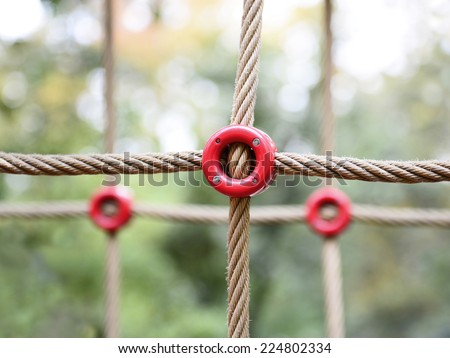 Playground rope crosses with red rings