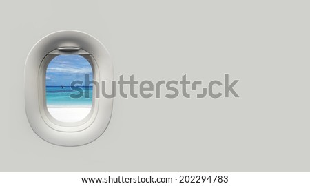 beach and tropical sea at Airplane window and place for text