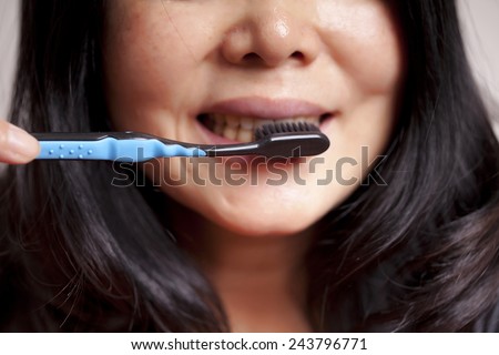 Shot of perfect teeth with toothbrush, on white background.