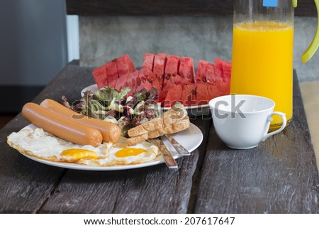 American breakfast with orange juice and watermelon.