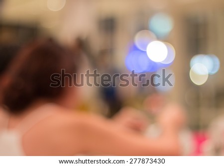 Blurred women in restaurant and bokeh background.