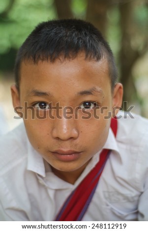Mae Hong Son, Thailand - August 03, 2010: An unidentified Burmese refugee student on the way back home from school in Mae La Ma Luang temporary shelter in Mae Hong Son, Thailand