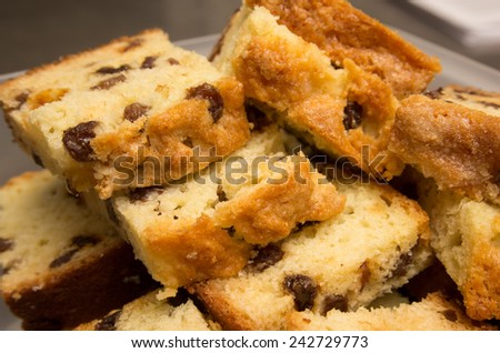 Raisin bread in a storage container, ready to take to a friend\'s house to share.