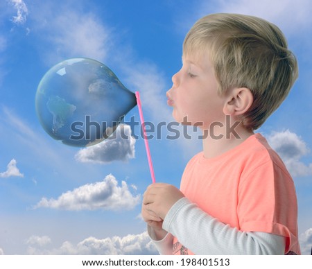 a boy creating a new world blowing through a bubble maker