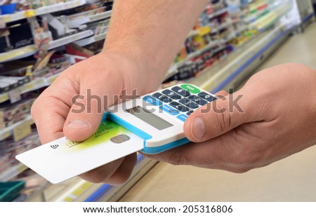 Using a card in card reader for payment in a food shop