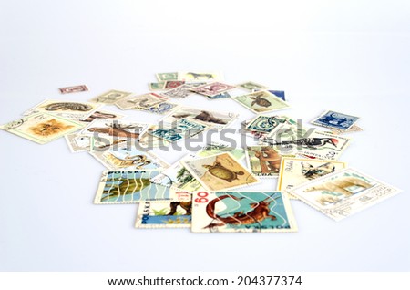 backdrop of old worldwide postage stamps
