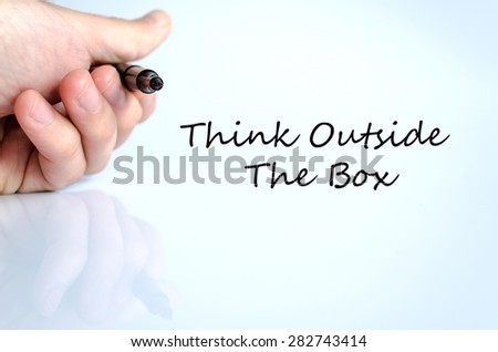 Pen in the hand isolated over white background Think outside the box concept