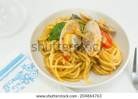 spicy spaghetti clams on the white  table